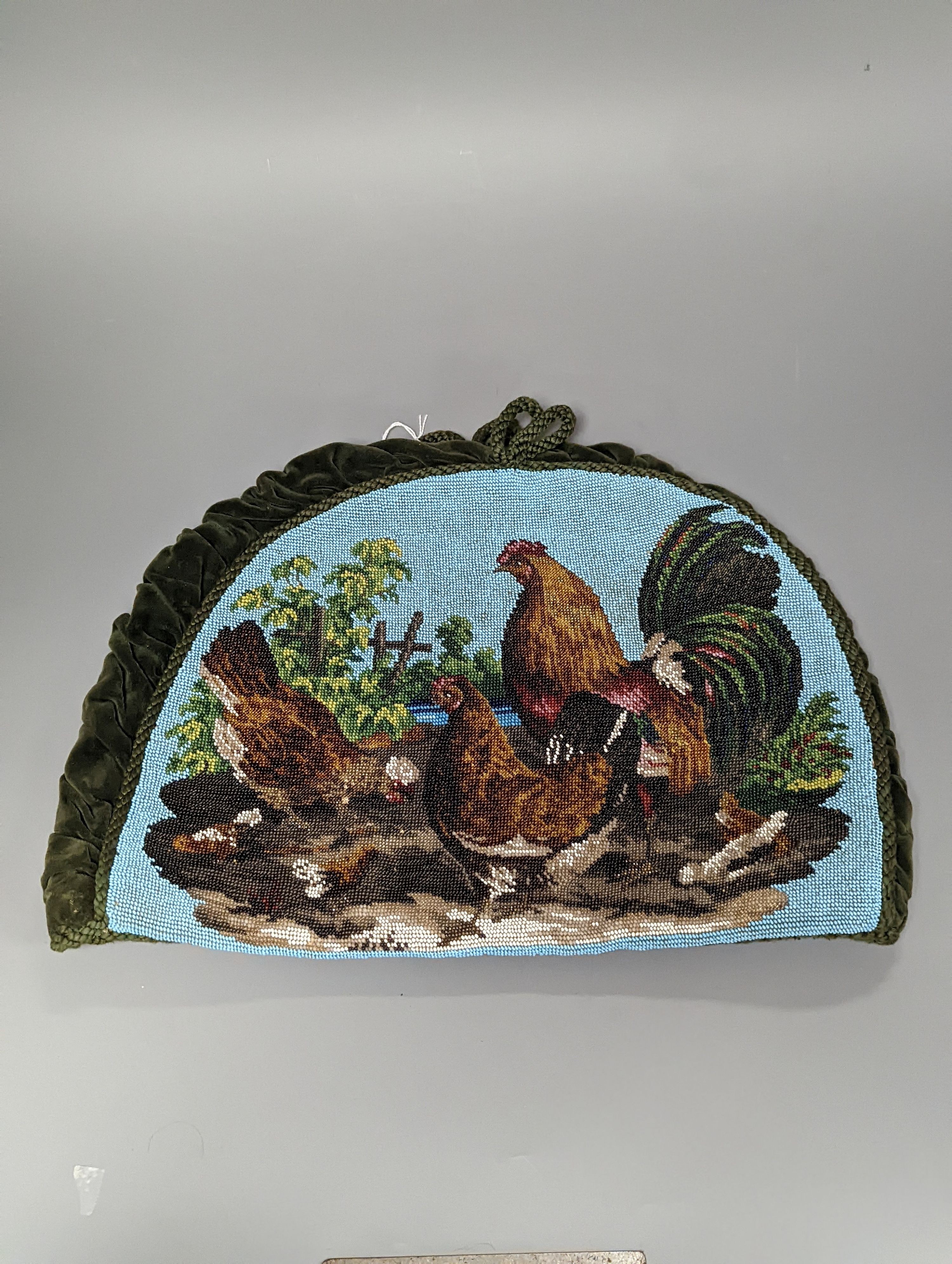 A 19th century beadwork tea cosy, with chicken design to both sides